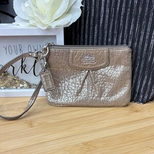 Coach Shimmering champagne Wristlet.